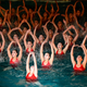Synchronized swimmers perform during a celebration for the birthday of the late Kim Jong-il.
